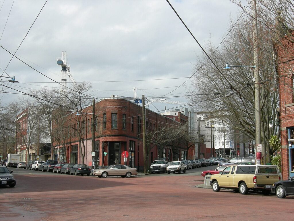 Brick corner building and storefronts along Ballard Avenue