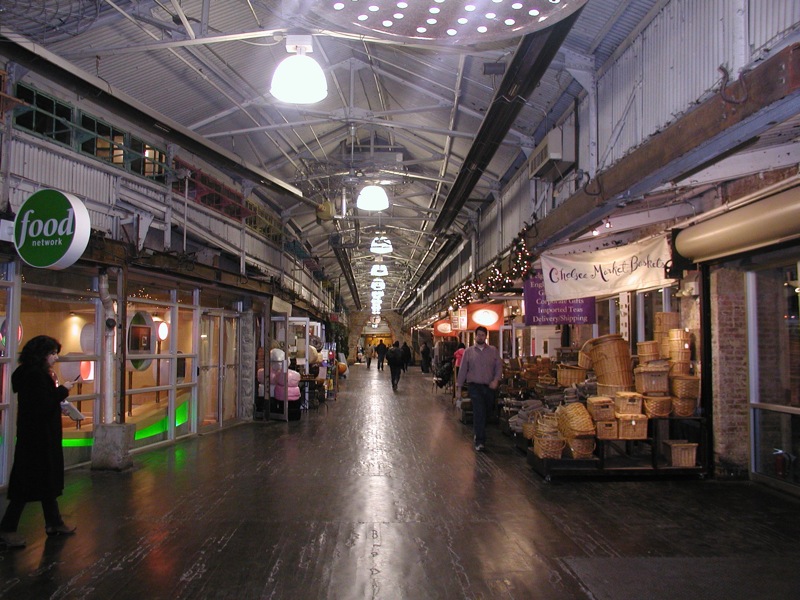 Visitors walking through the indoor corridor at Chelsea Market