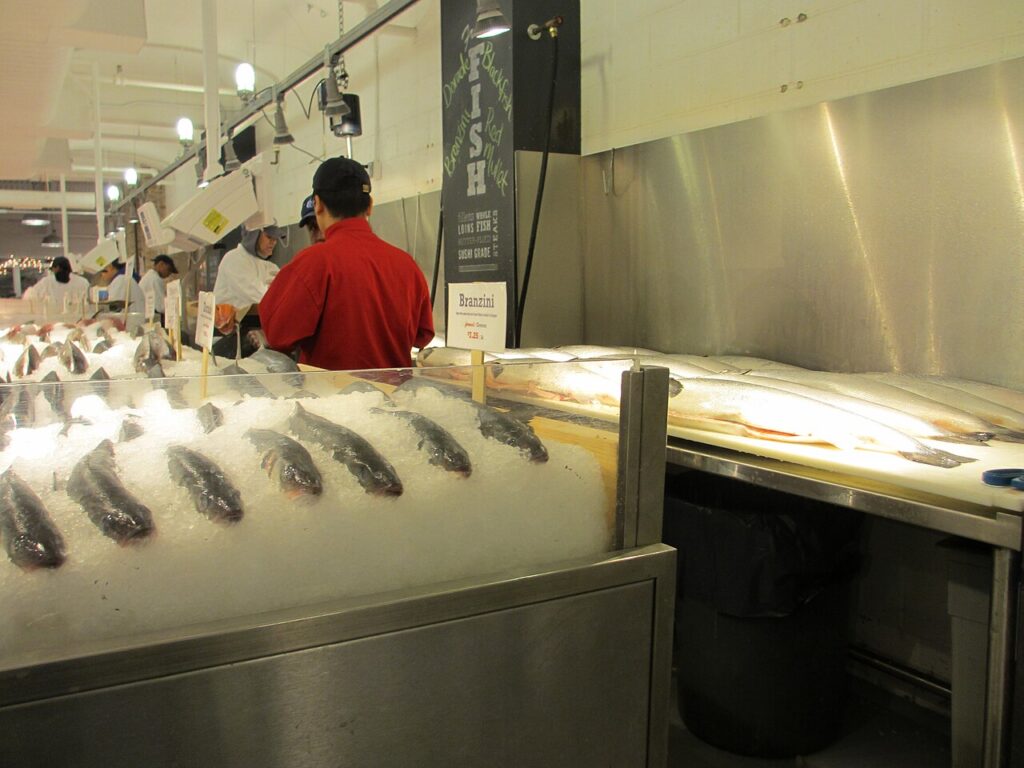 Seafood counter with fish on ice inside Chelsea Market