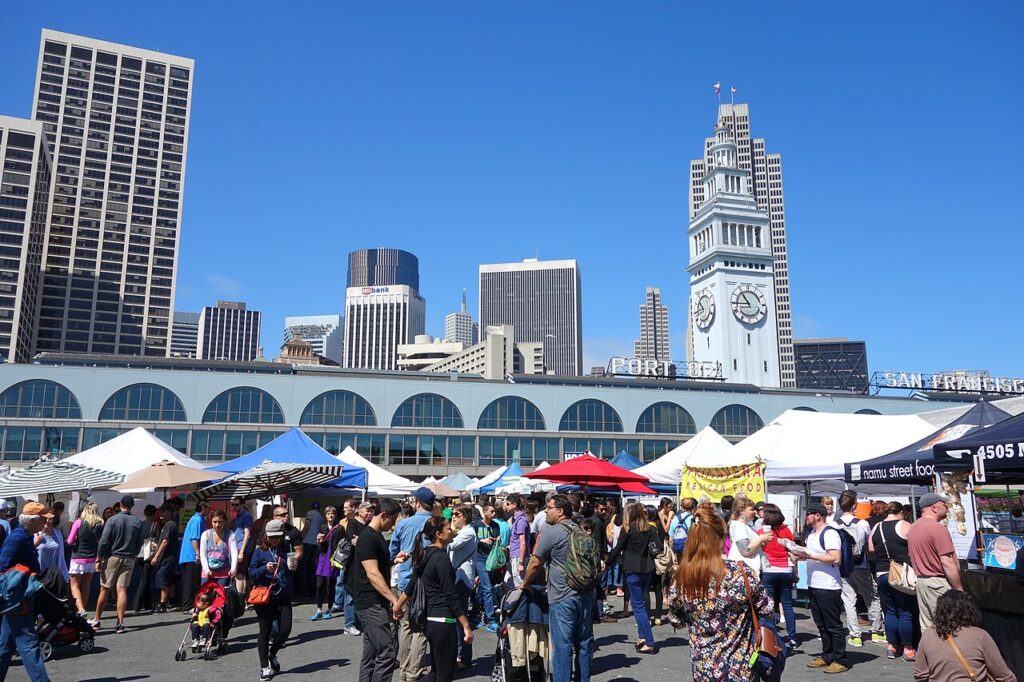 Farmers market tents and shoppers outside the Ferry Building