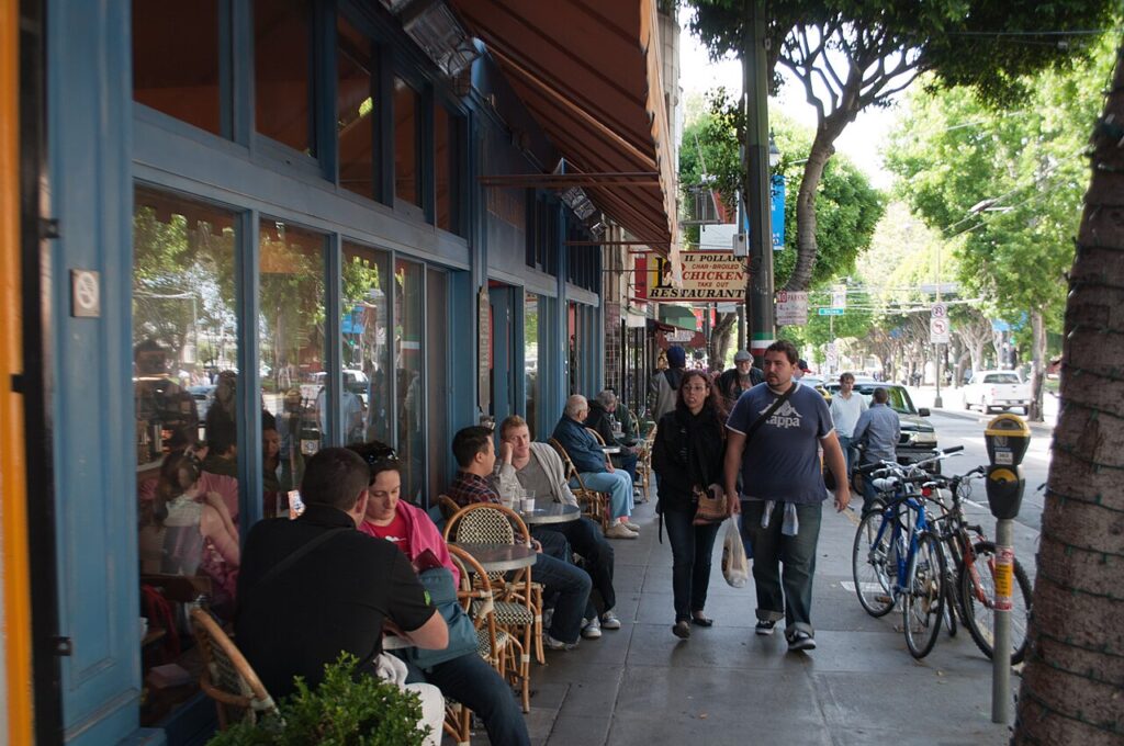 People outside cafés along Columbus Avenue in North Beach