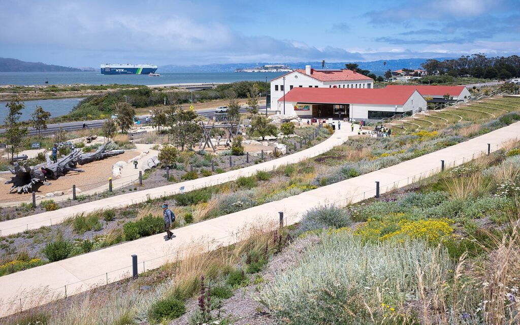 Landscaped paths at Presidio Tunnel Tops with the bay beyond