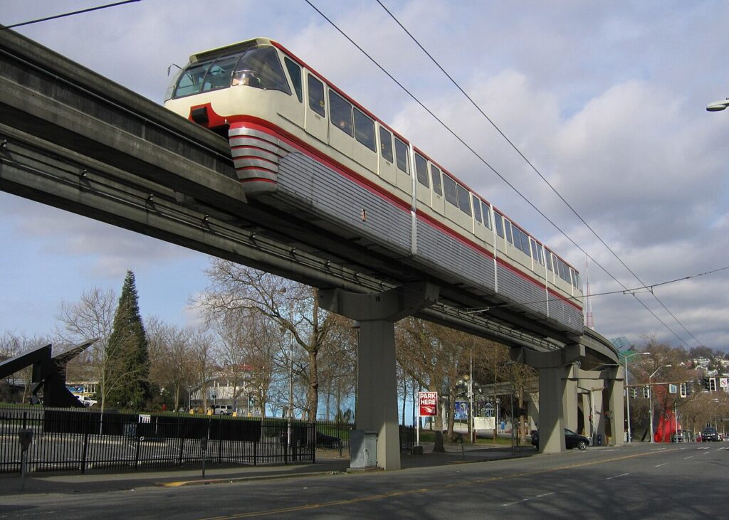 Seattle Center Monorail train traveling above the street